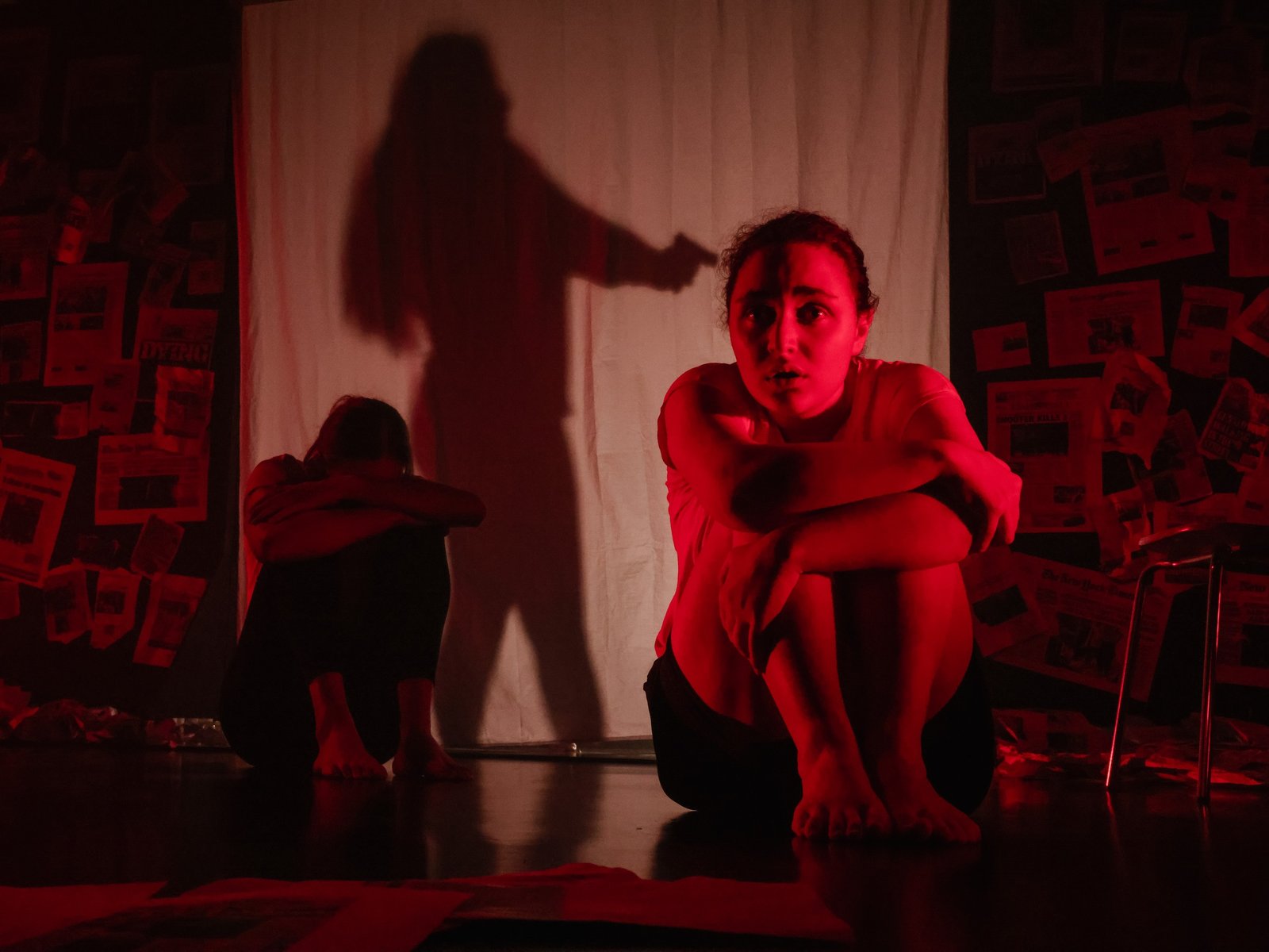 Red-lit theatre performance scene